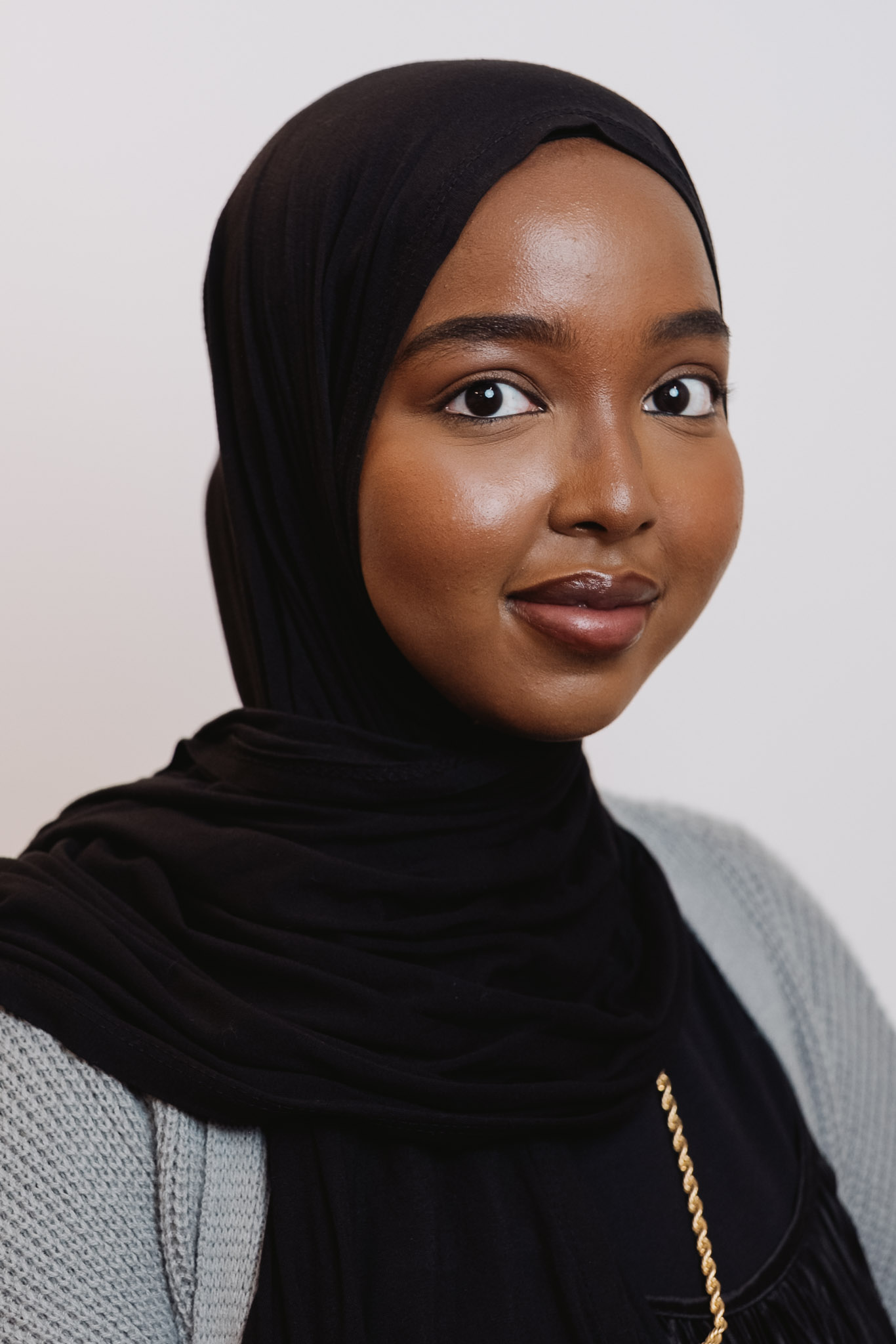 Professional headshot — light studio setup, consistent framing.